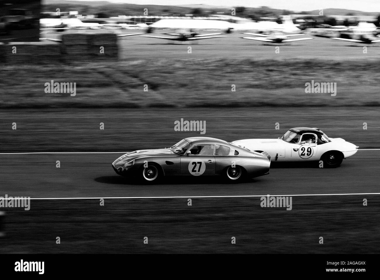 GOODWOOD, UNITED KINGDOM - Sep 09, 2017: A high angle grayscale shot of beautiful sports cars riding in Goodwood city of the UK Stock Photo
