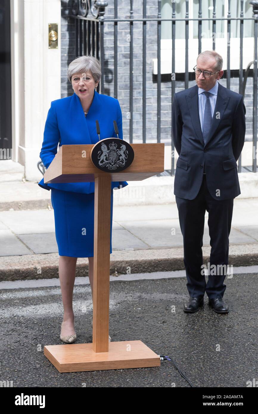 British Prime Minister Theresa May and her husband Philip stand on the  doorstep of 10 Downing street, London, after addressing the press Friday,  June 9, 2017 following an audience with Britain's Queen