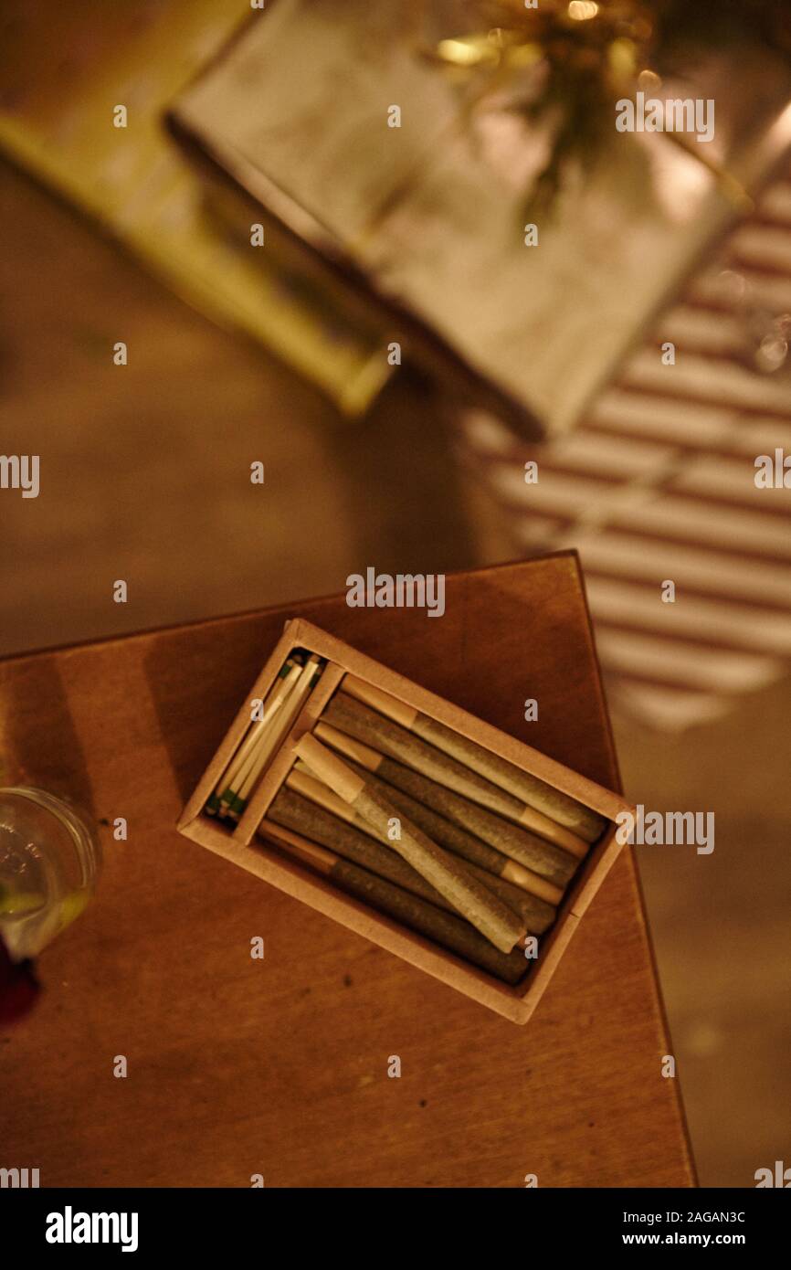 Download A Vertical High Angle Shot Of A Box With Marijuana Blunts On A Wooden Table Stock Photo Alamy PSD Mockup Templates