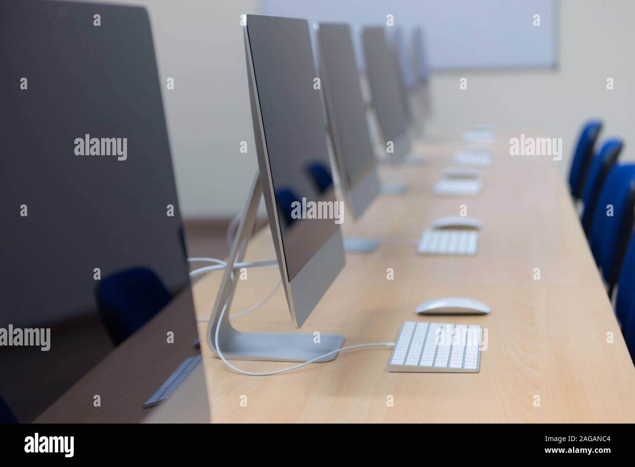 Modern office with computers on desks. Empty computer room in college ...