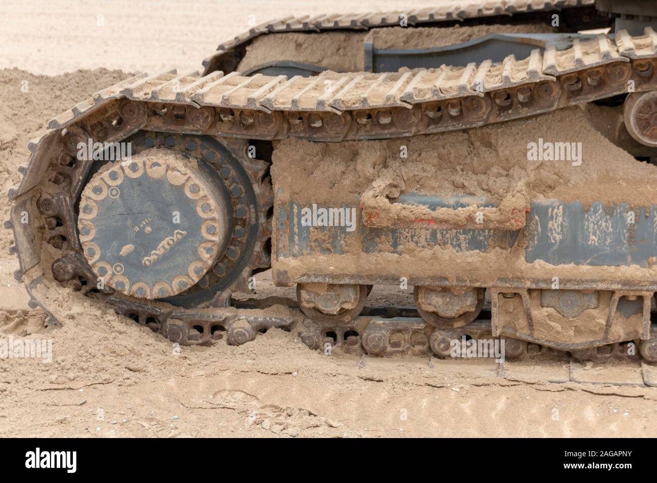 A close up view of a volvo grader digging up sand on Durban beach Stock ...