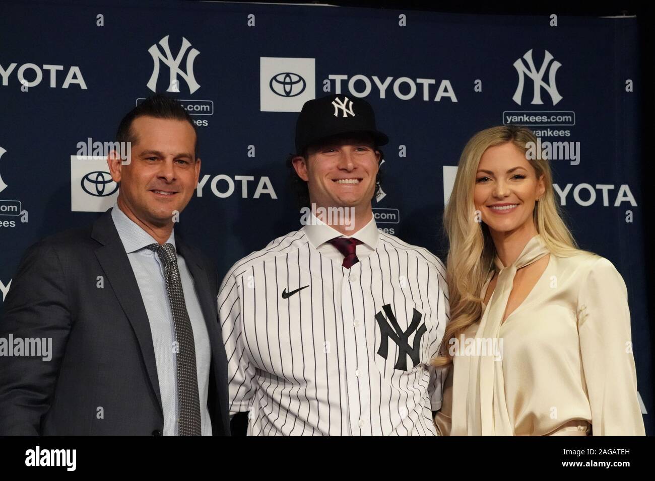 Bronx, United States. 18th Dec, 2019. Manager Aaron Boone with Gerrit Cole  and his wife Amy Cole as the New York Yankees hold a press conference  introducing their new $324 million pitcher