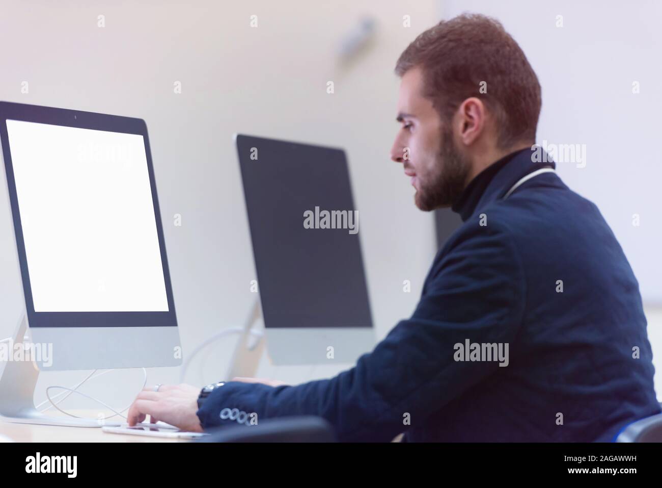 Young male Businessman working on modern computer. Businessman using ...