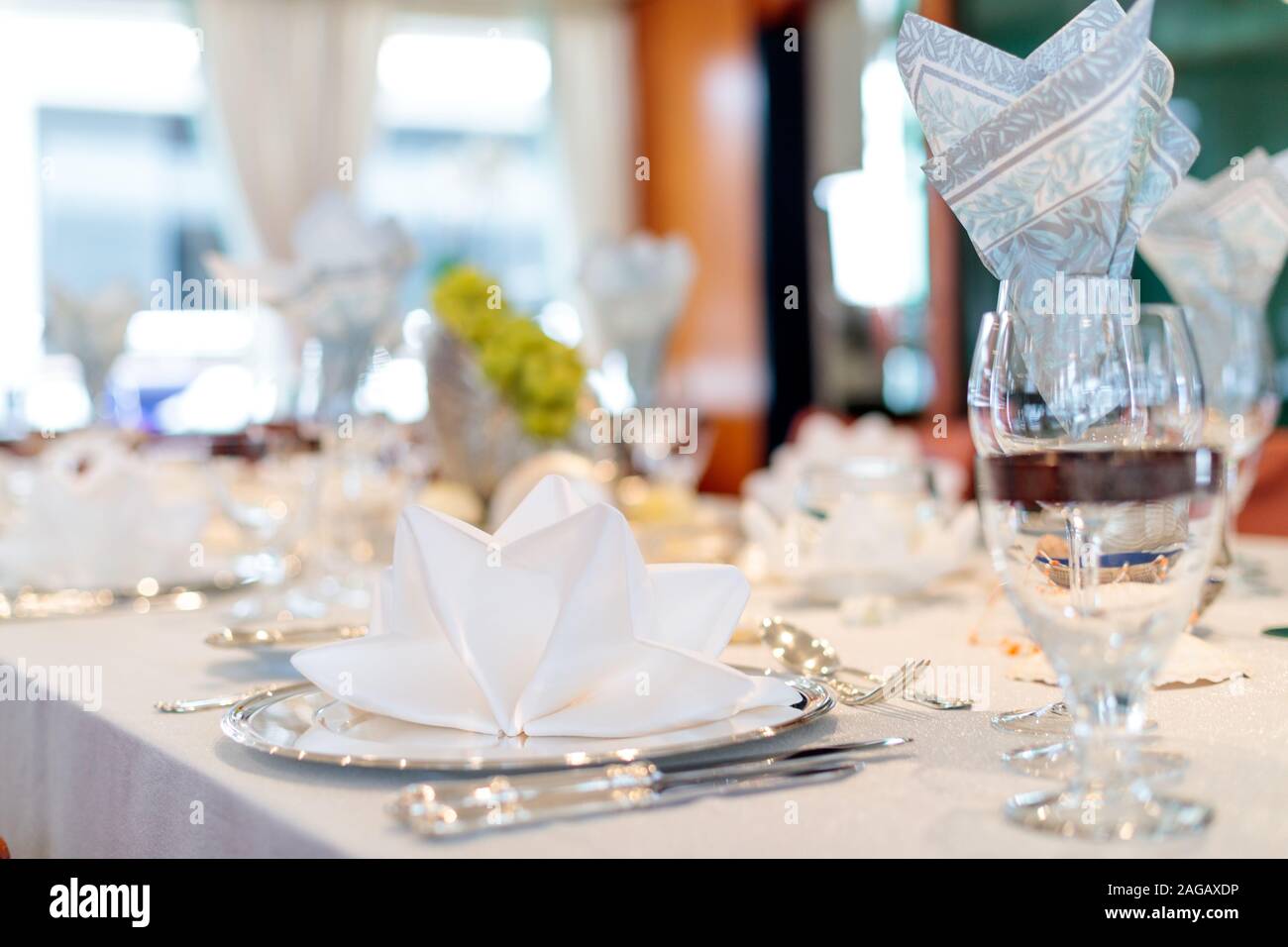 A Wedding Reception Table Setting With Champagne Glasses And