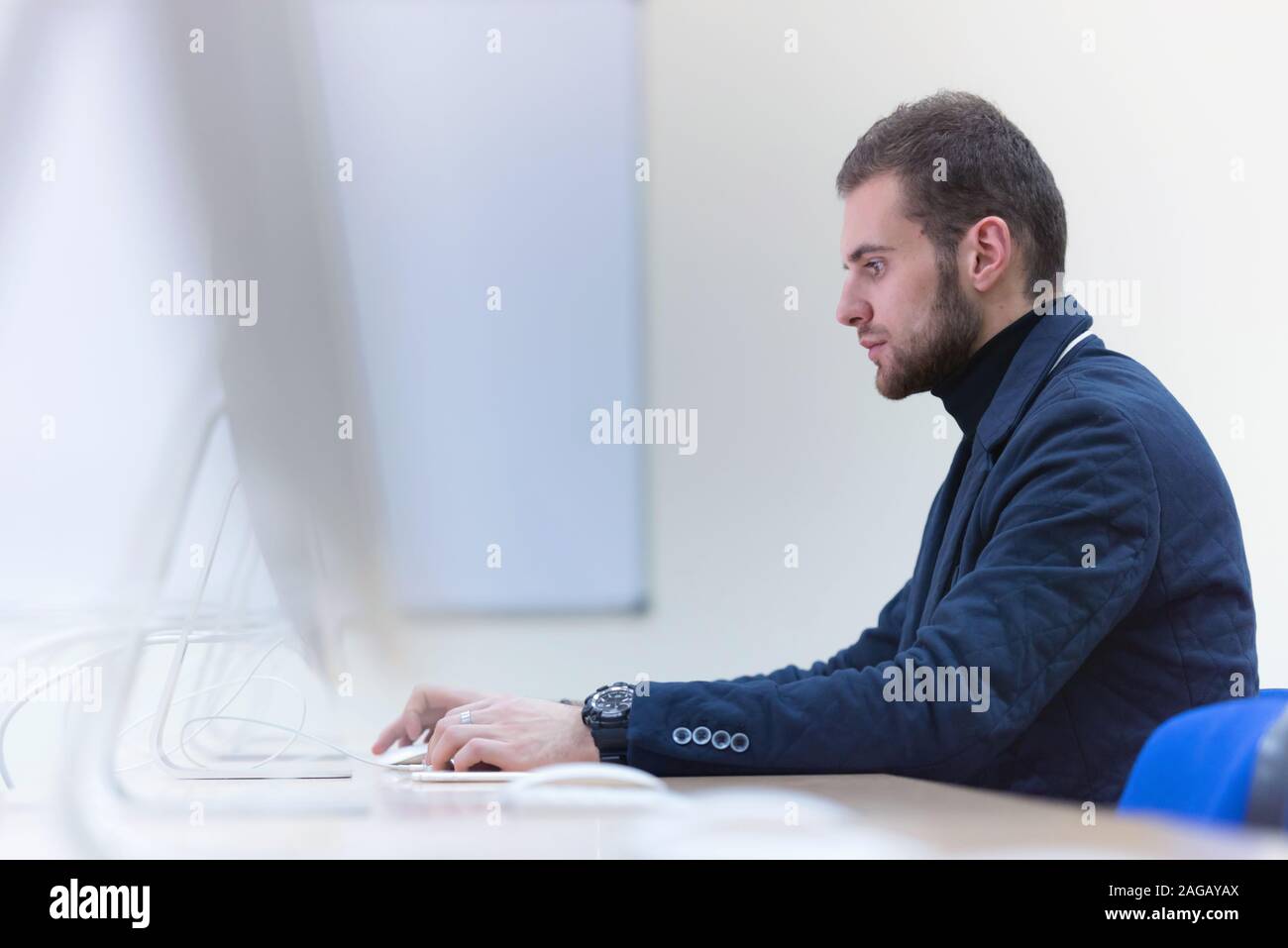 Programming. Man Working On Computer In IT Office, Sitting At Desk Writing Codes. Programmer Typing Data Code, Working On Project In Software Developm Stock Photo