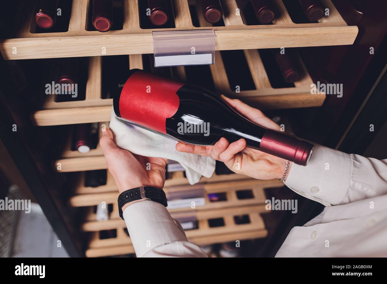 Storing bottles of wine in fridge. Alcoholic card in restaurant