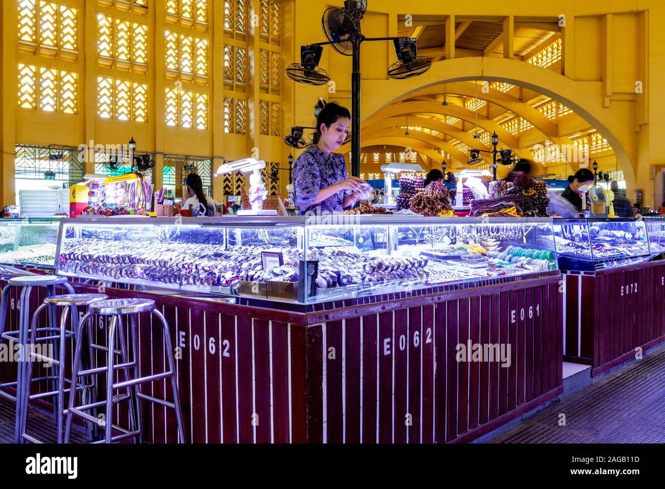 A Young Woman Selling Watches and Jewellery At The Central Market, Phnom Penh, Cambodia. Stock Photo