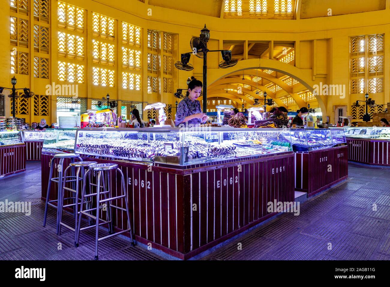 A Young Woman Selling Watches and Jewellery At The Central Market, Phnom Penh, Cambodia. Stock Photo