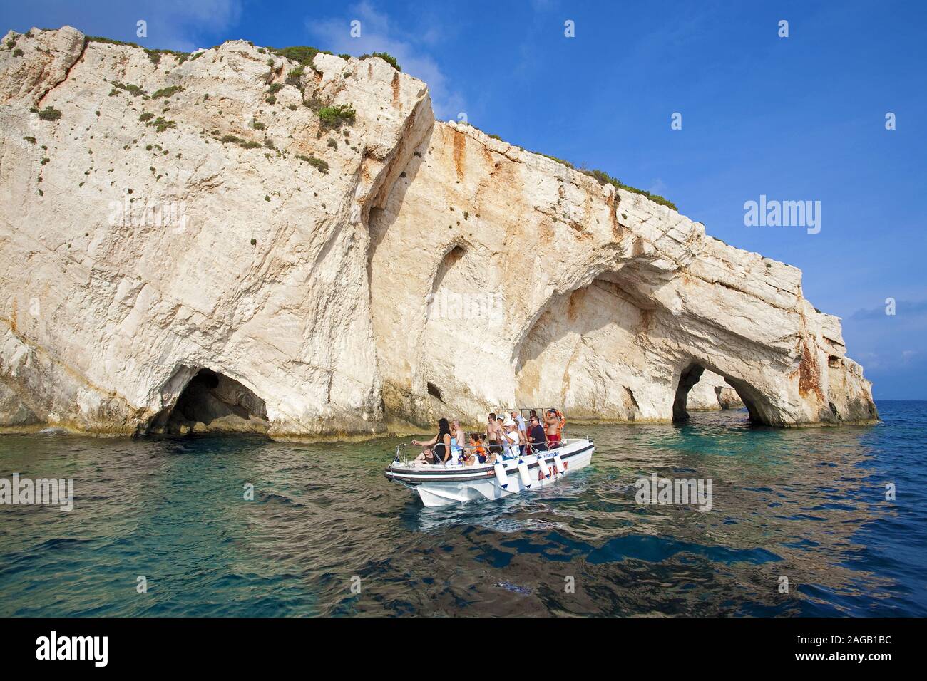 Pleasure boat with tourists at the blue cave, Kap Skinari, Zakynthos, island, Greece Stock Photo