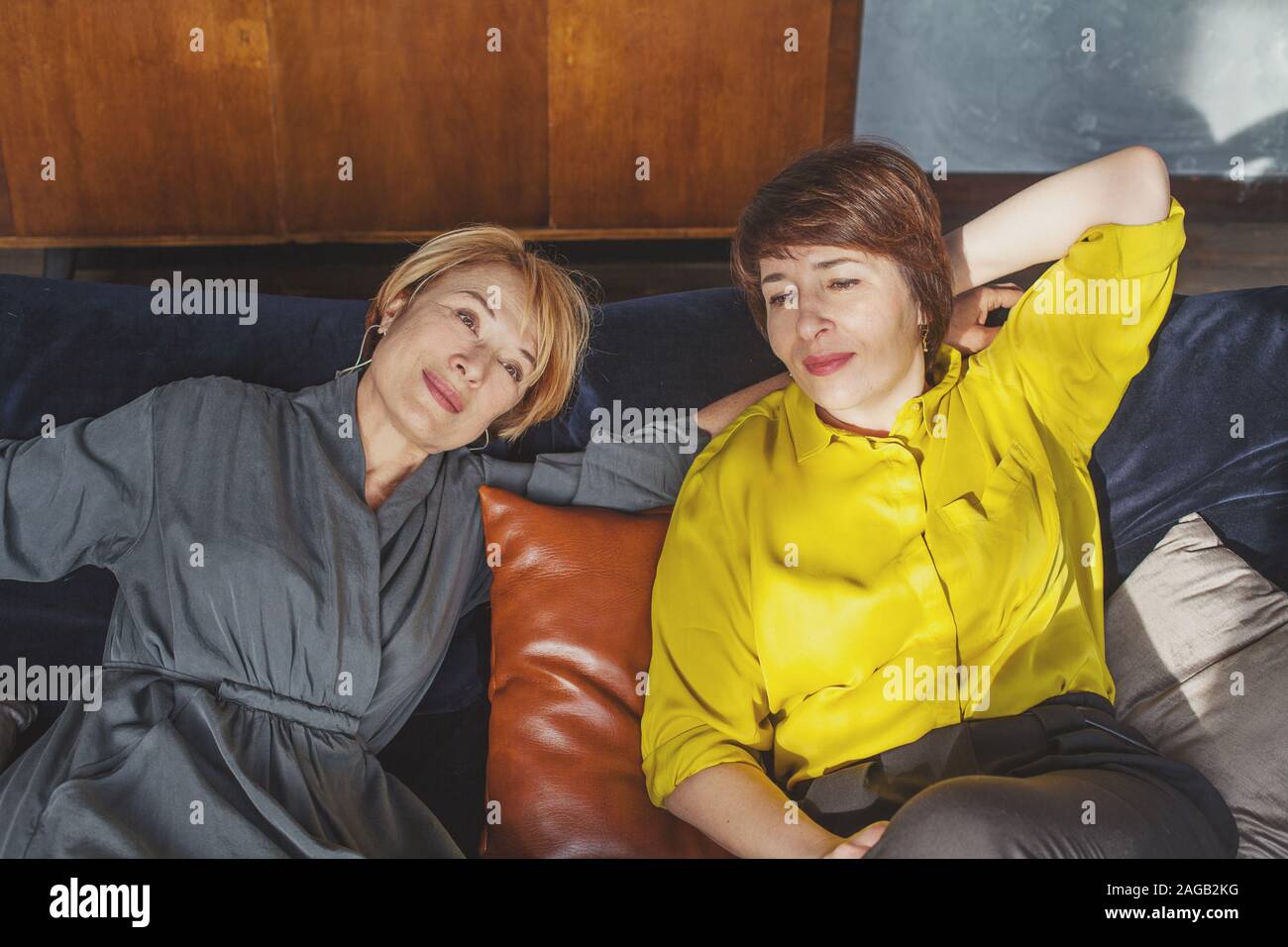 Middle aged women resting, smiling and chatting Stock Photo