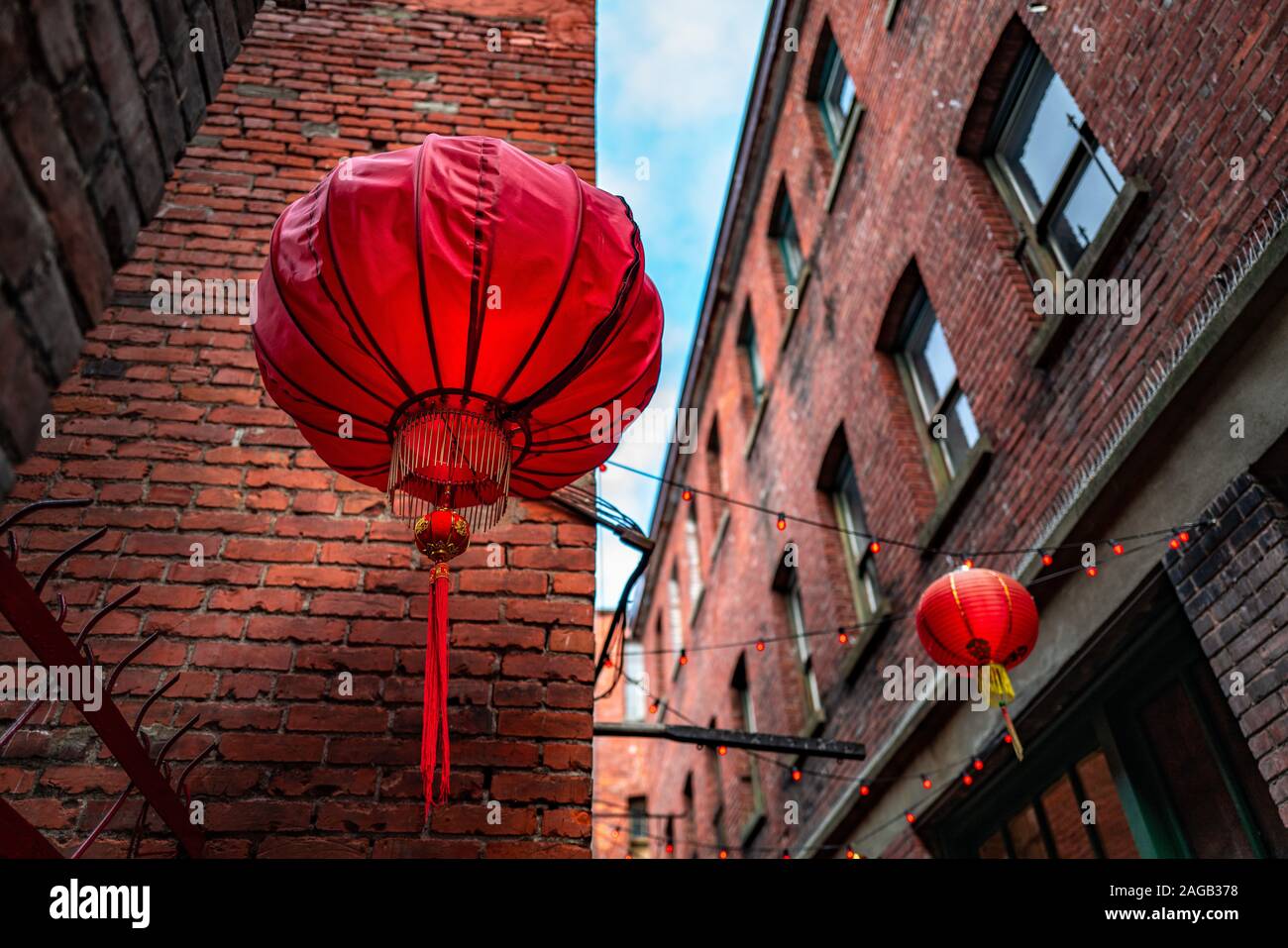A low angle shot of Chinese lanterns in Fan Tan Alley, Chinatown