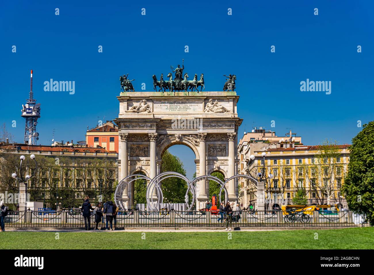 Unidentified people by Arch of Triumph (Arco della Pace) at Park Sempione in Milan, Italy. Stock Photo
