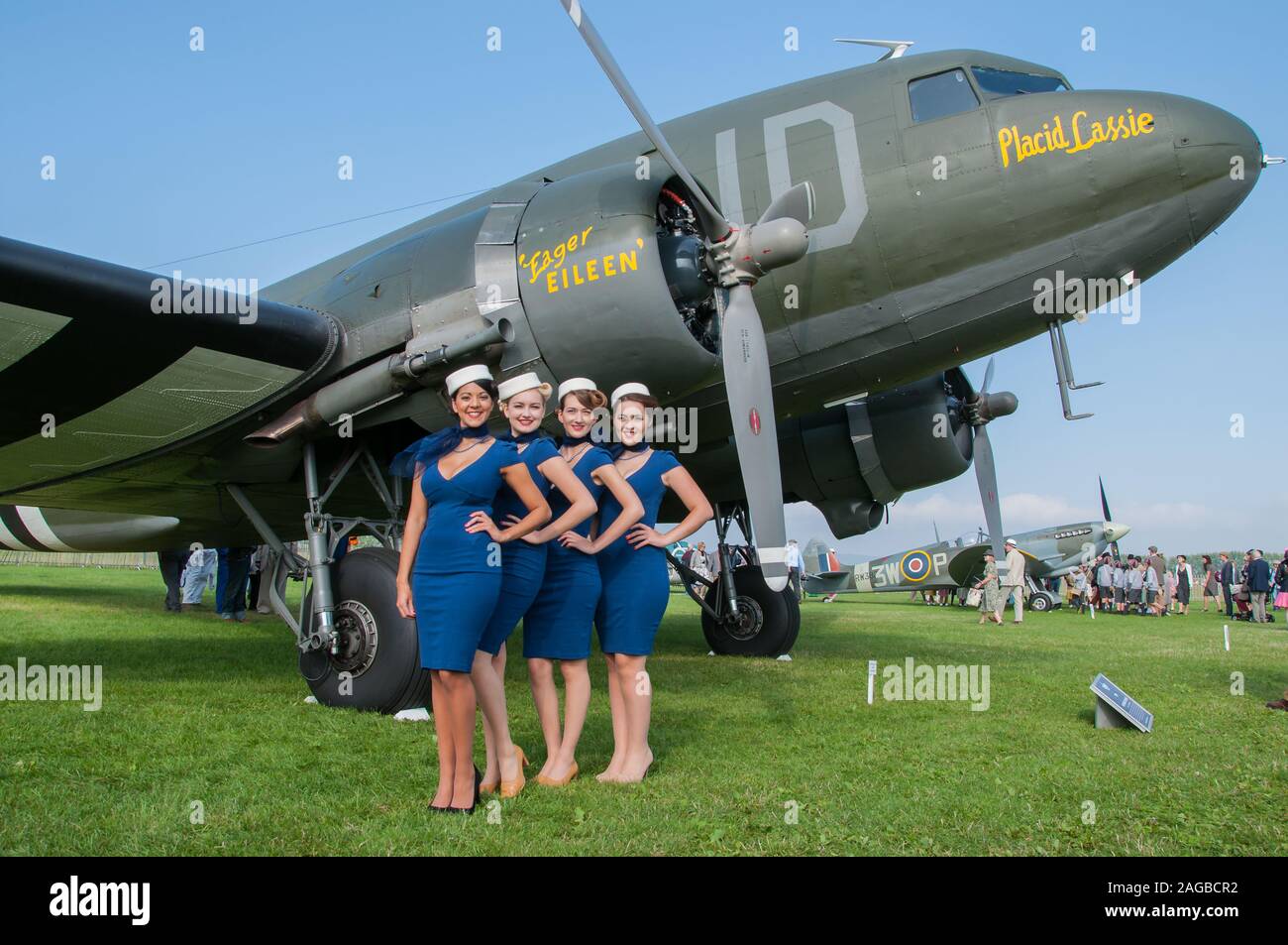 Period female flight attendant costumes at the Goodwood Revival 2014 in the Freddie March Spirit of Aviation. Females in period dress. C-47 Dakota Stock Photo