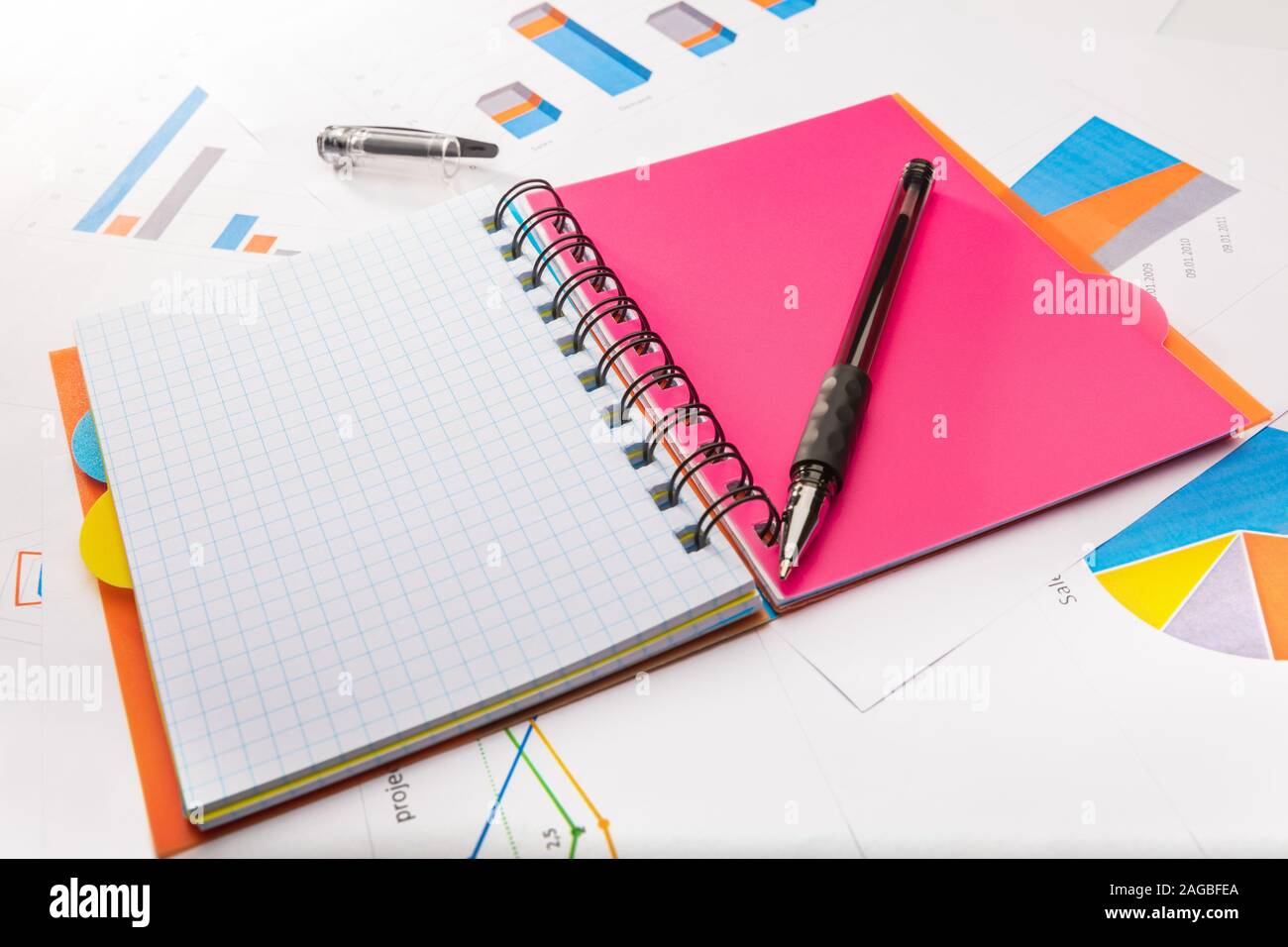 Study concept with school notebook, papers and a pen Stock Photo