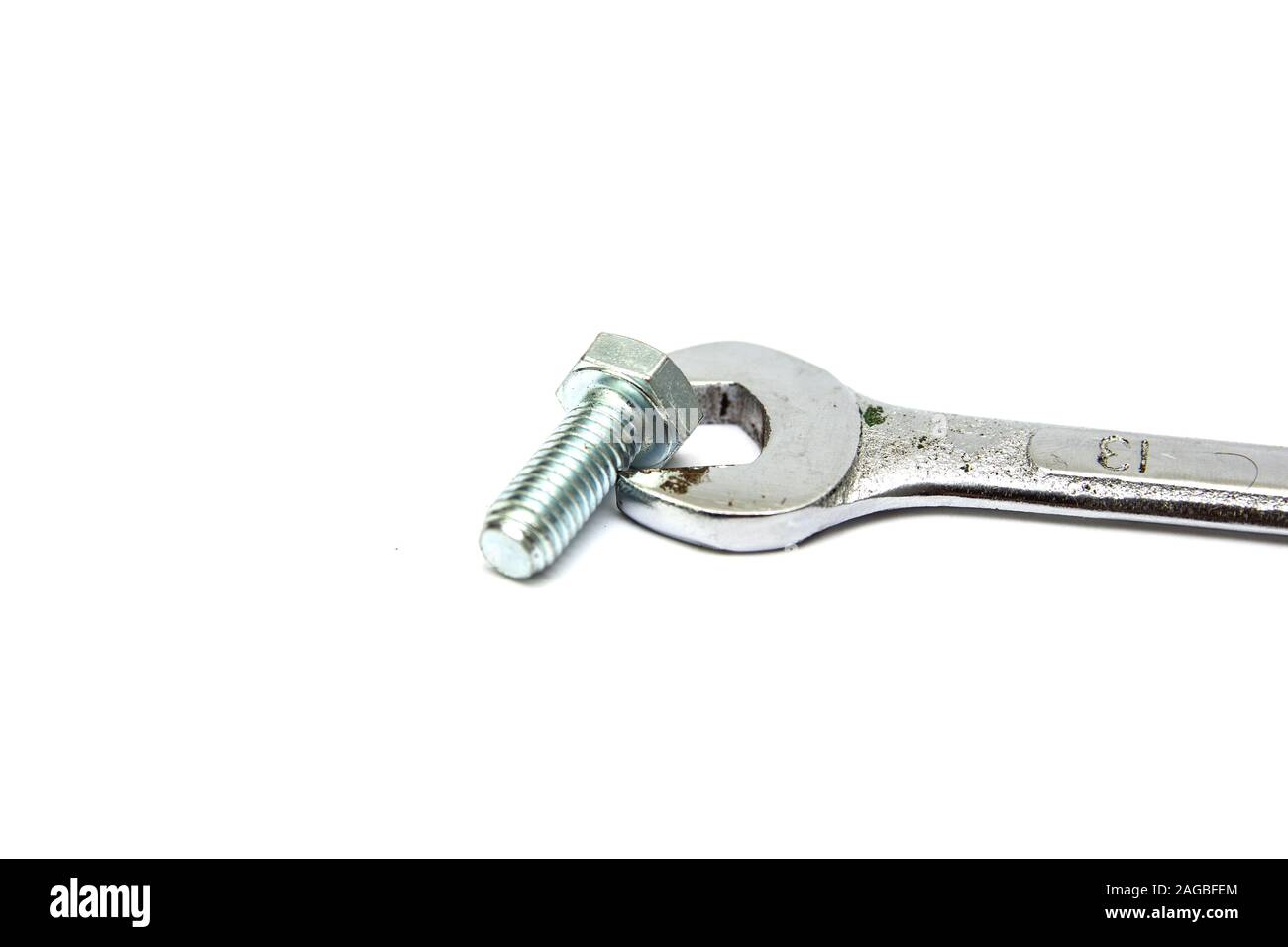 Wrench and bolt isolated on a white background Stock Photo Alamy