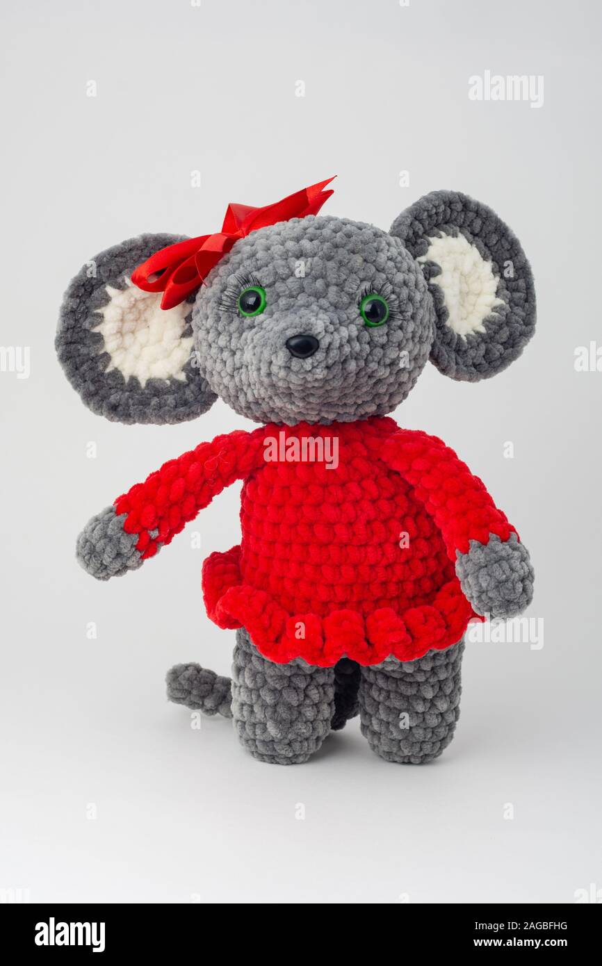 Plush mouse with a red bow on its head Stock Photo
