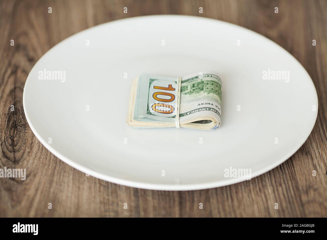 Plate with money. Greedy corruption concept. Bribe idea Stock Photo