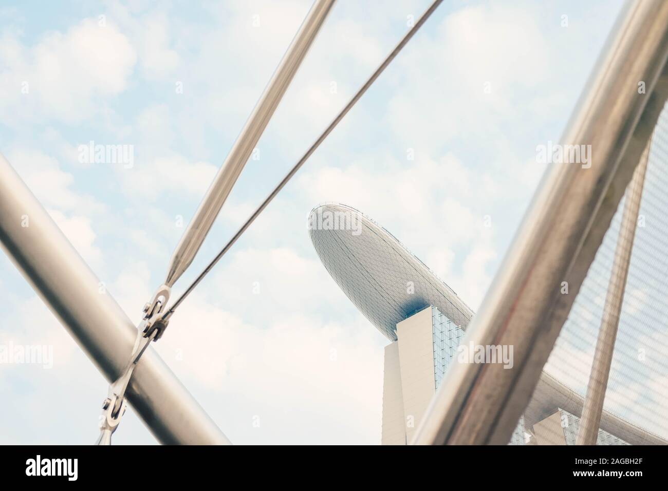 Low angle shot of a glass building under the blue sky captured in ...