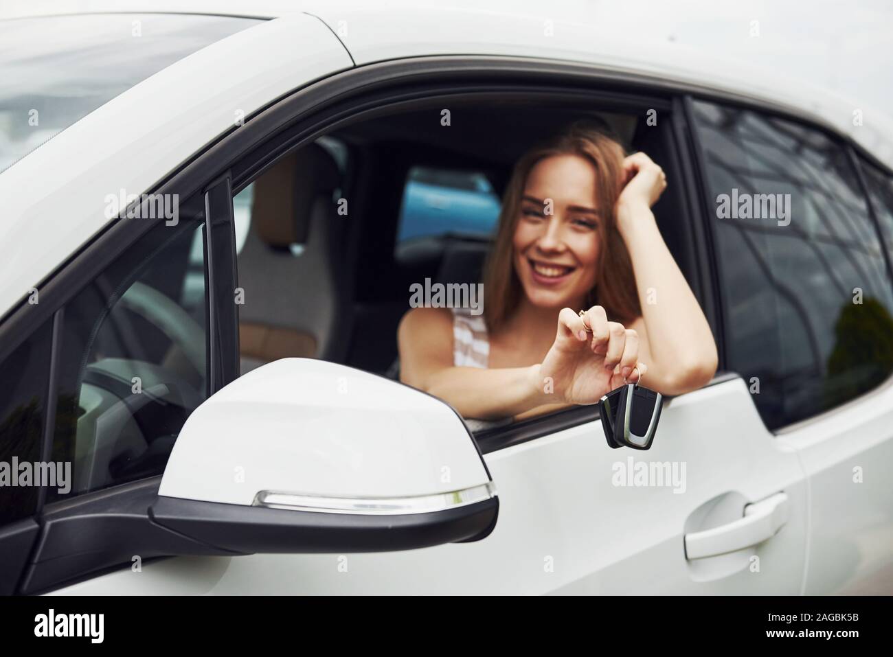 Woman driver showing car keys hi-res stock photography and images - Alamy