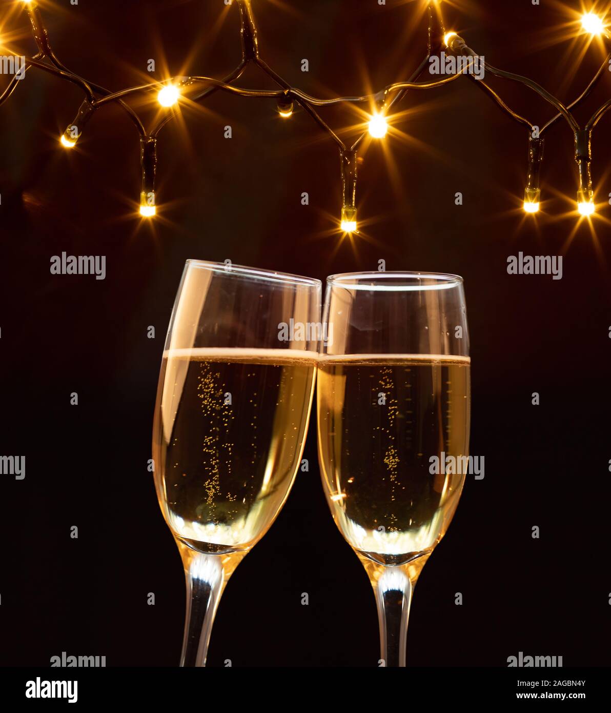 Champagne glasses on sparkling holiday background - Celebrating the New ...