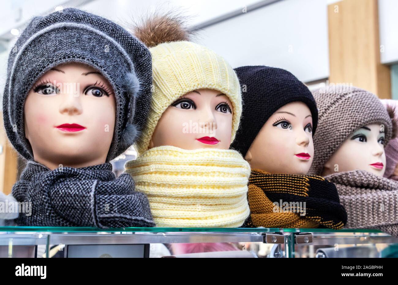 Mannequins female heads in hats and scarfs close up Stock Photo