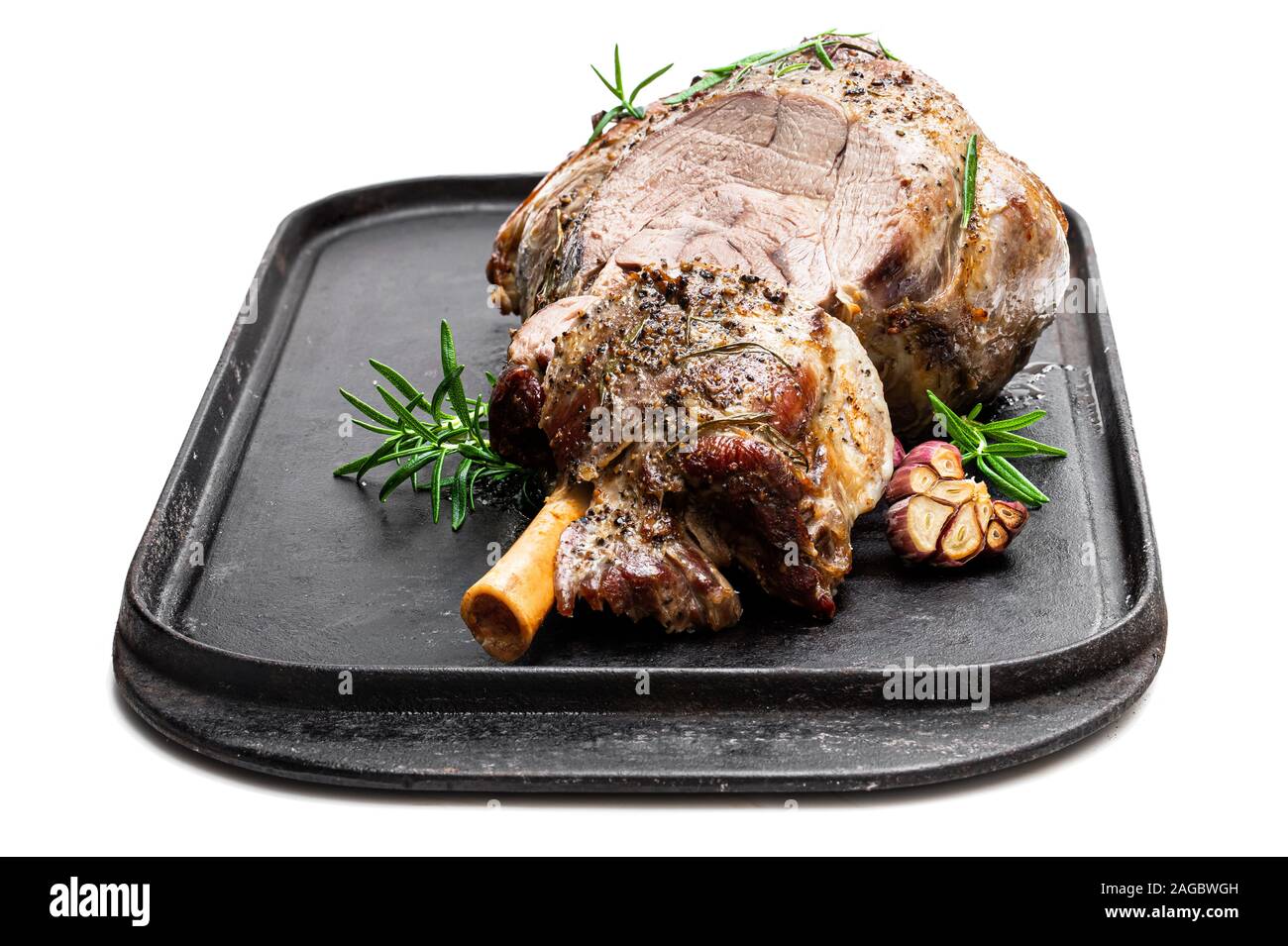 Whole roast lamb leg on grill tray isolated on white Stock Photo Alamy