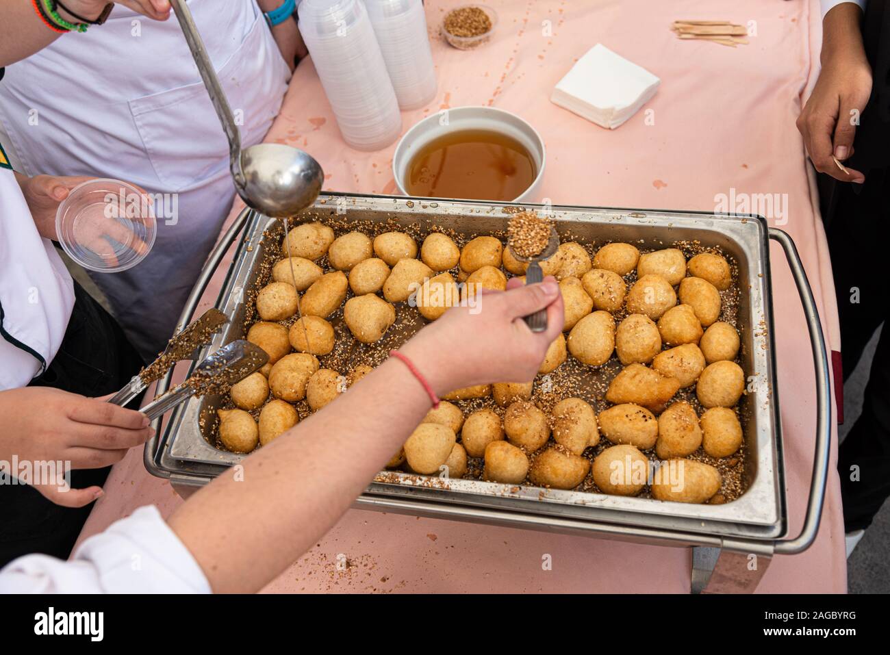 Sweet crispy crunchy Loukoumades famous deep fried greek traditional pastry desert served hot