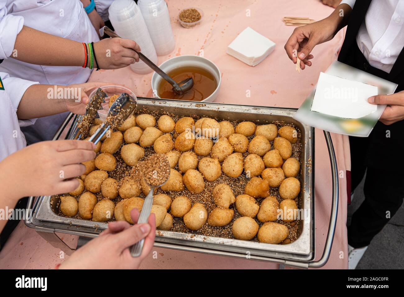 Sweet crispy crunchy Loukoumades famous deep fried greek traditional pastry desert served hot