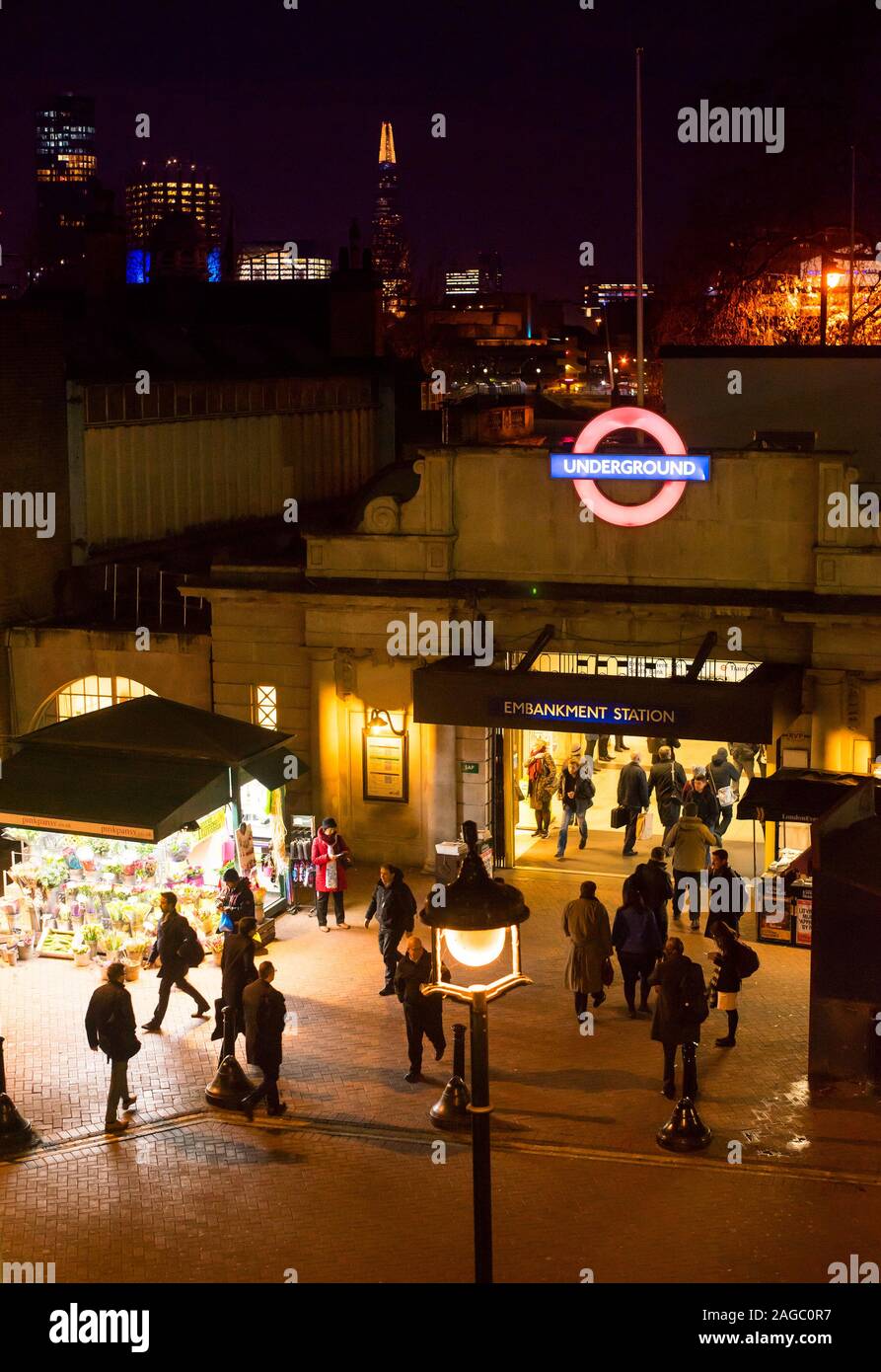 The entrance to Embankment Underground station, Villiers Street, London at night Stock Photo
