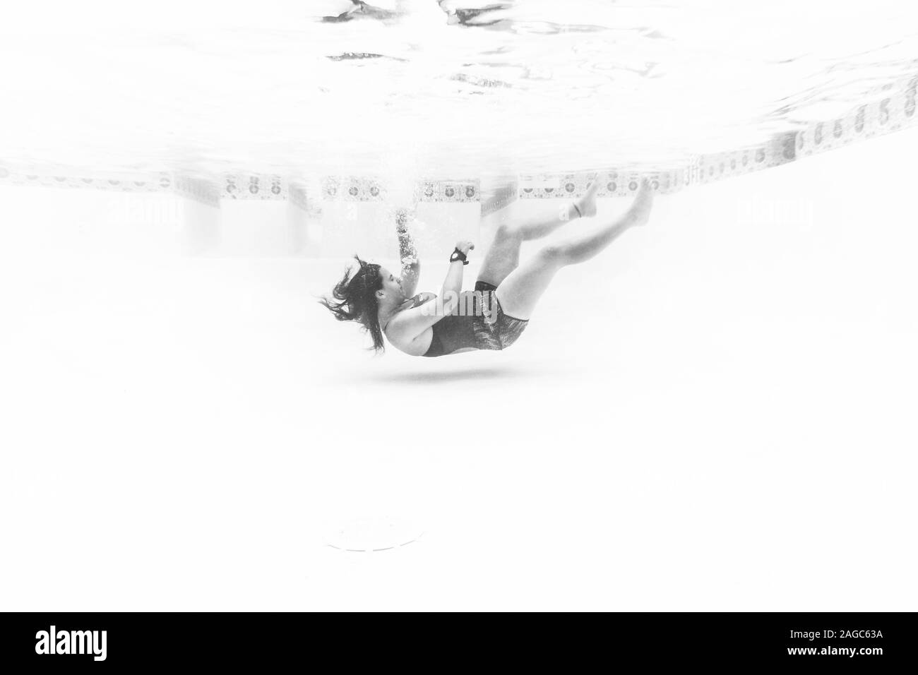 WACO, UNITED STATES - Jul 11, 2018: Underwater image of life guard falling to the bottom. Stock Photo