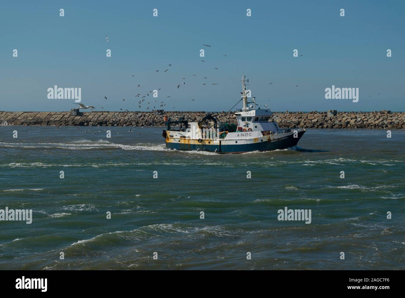A fishing trawler returns to the Port of Aveiro Portugal Stock Photo