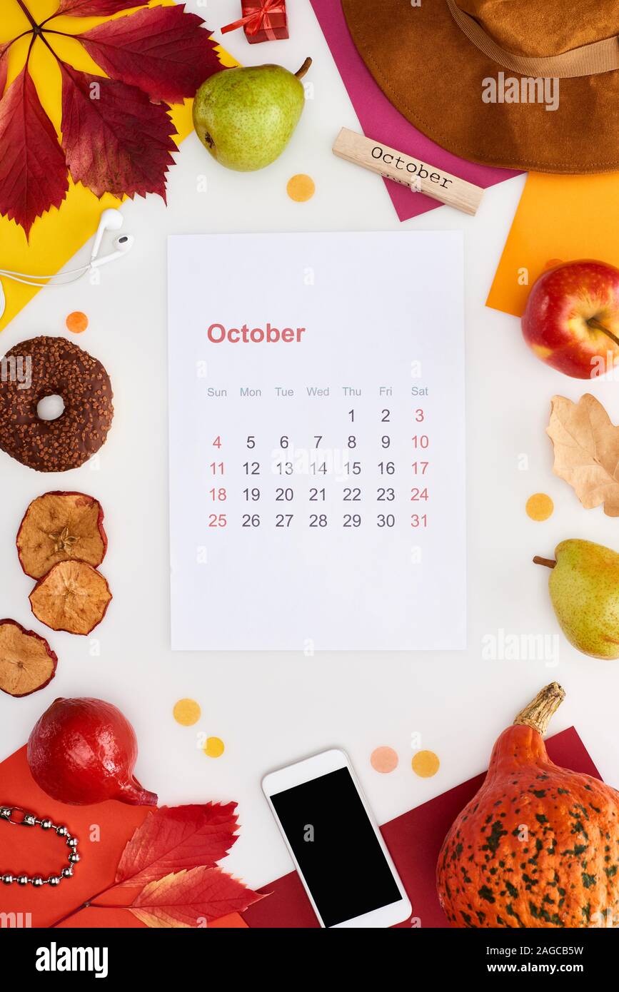 october calendar page hat smartphone fruits pumpkin dry leaves october calendar page hat smartphone fruits pumpkin dry leaves