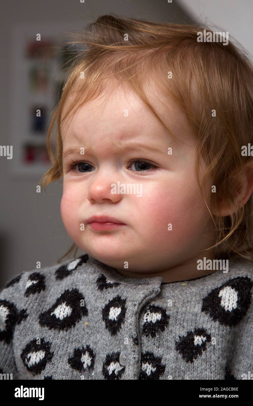 14 month old toddler girl not happy, UK Stock Photo