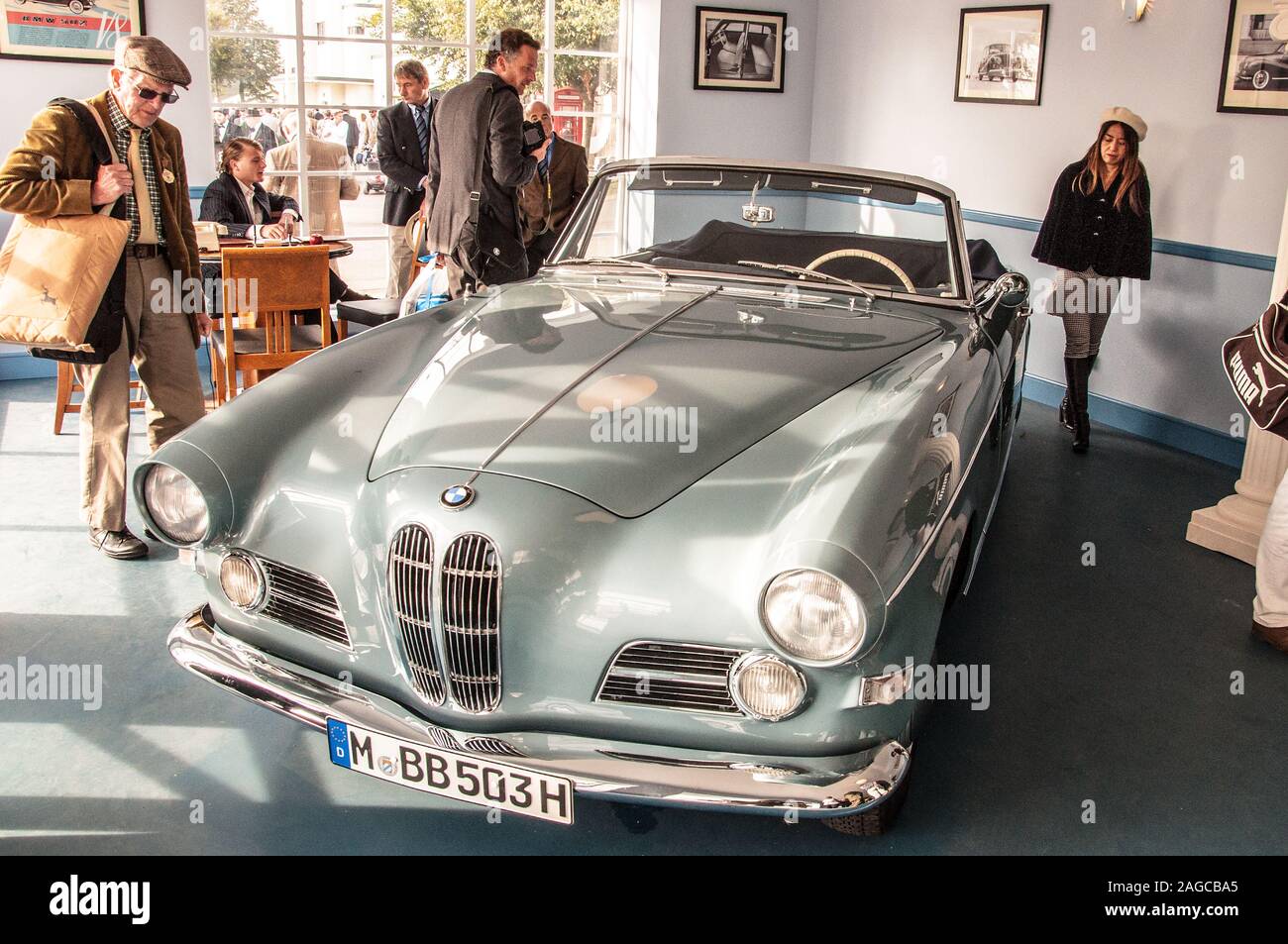 BMW car showroom at the Goodwood Revival vintage event in West Sussex, UK. Vintage, classic BMW 503 in a retro car sales scenario. Auto sales Stock Photo