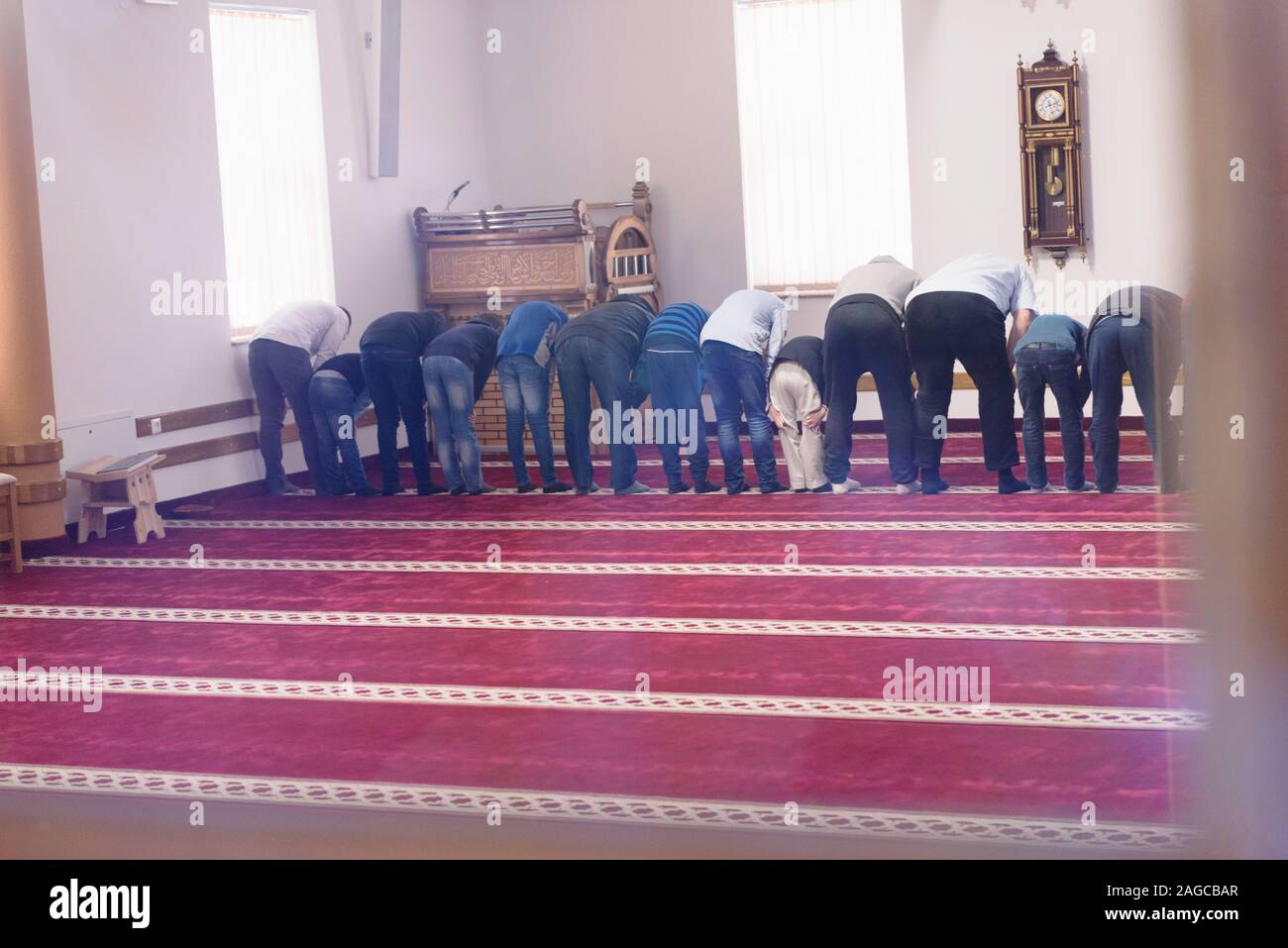 Religious muslim prayers praying together inside the big mosque Stock ...