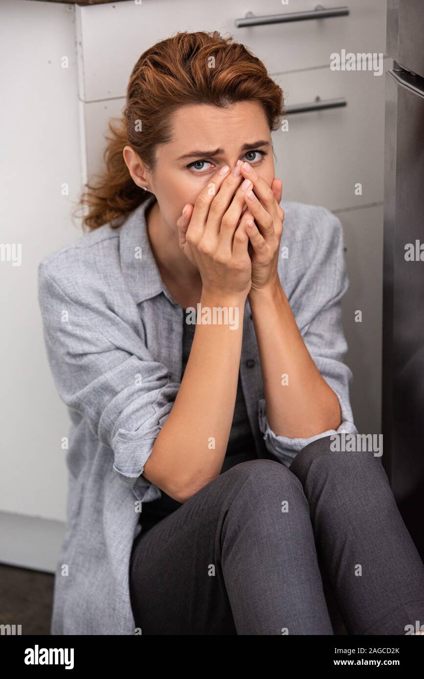 Sad woman covering face hi-res stock photography and images - Alamy
