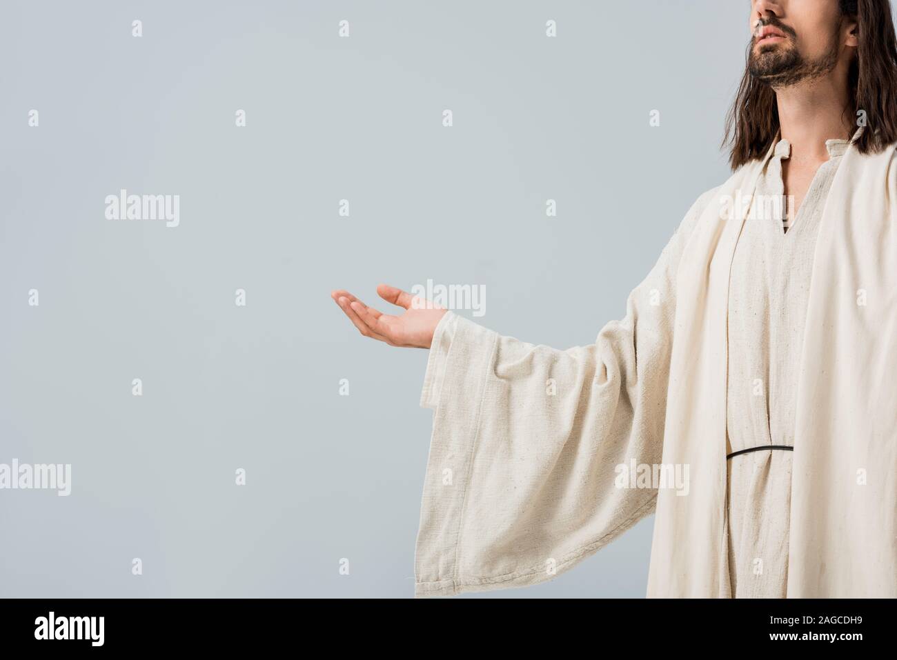 cropped view of jesus with outstretched hand isolated on grey Stock Photo