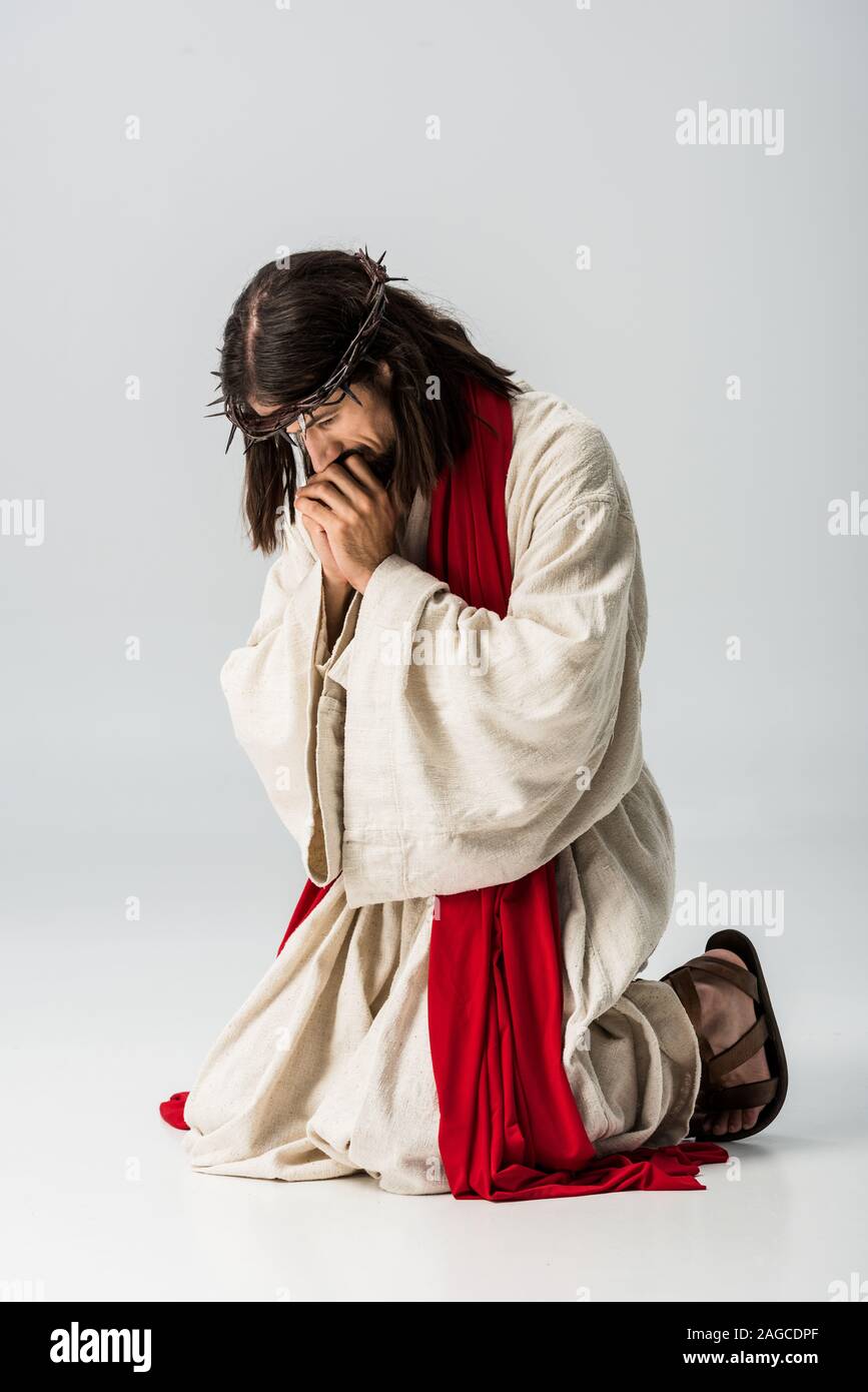Man on knees praying hi-res stock photography and images - Alamy