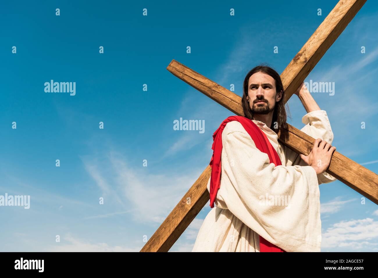 Jesus holding cross hi-res stock photography and images - Alamy