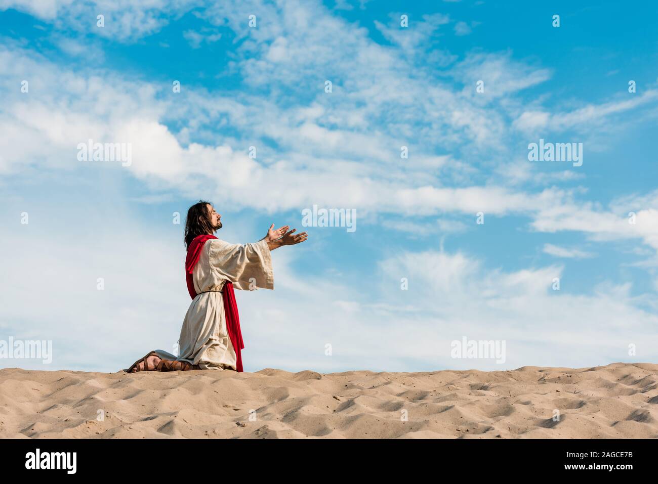 Praying on knees hi-res stock photography and images - Alamy