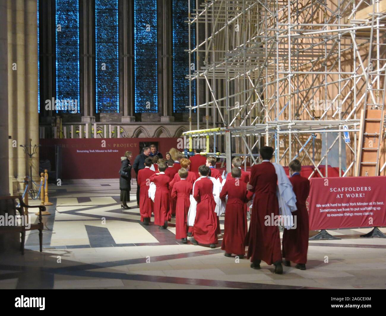 Parade of choirboys inside the Minster on their way to Choral Evensong; York Minster, December 2019 Stock Photo