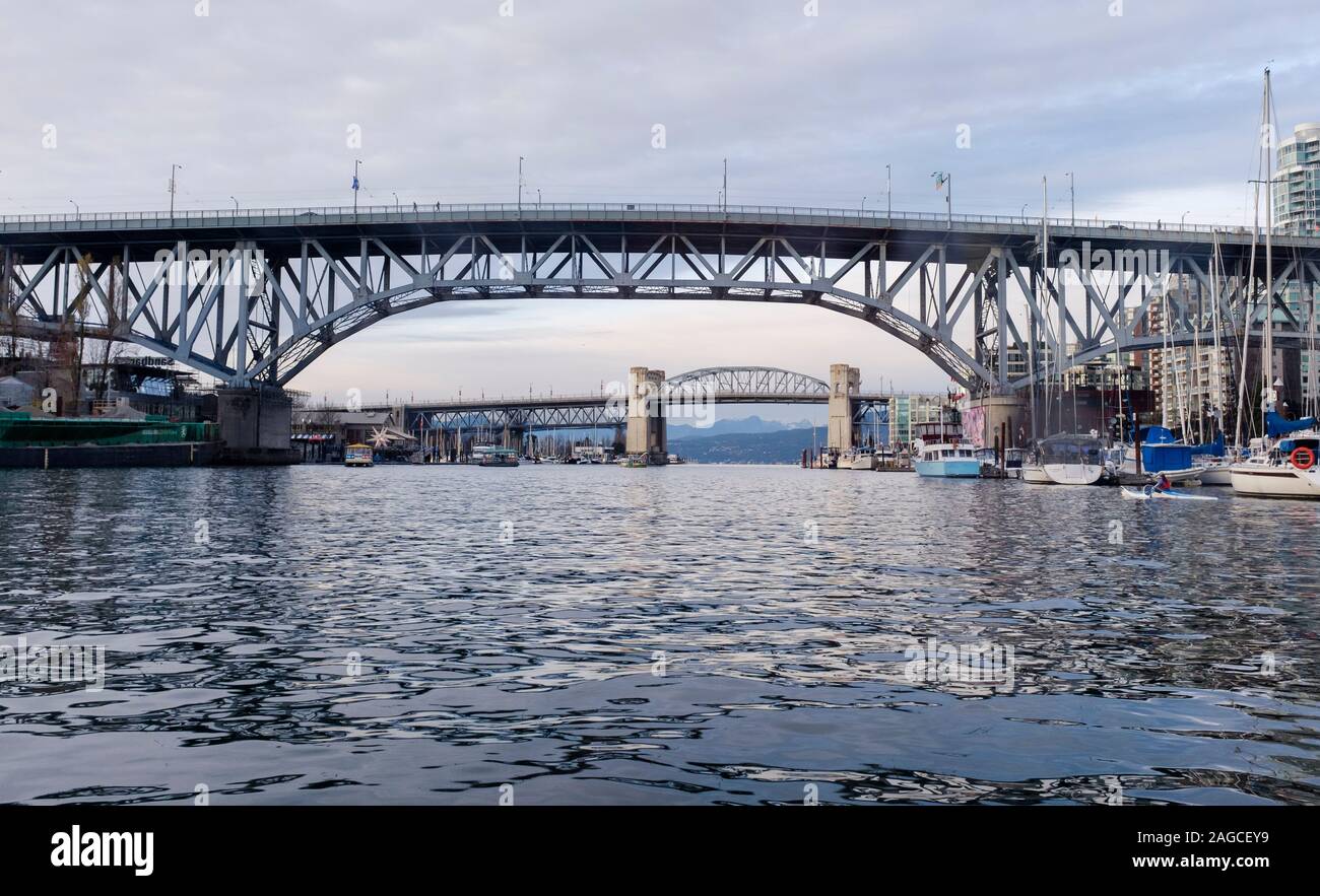 View of the Granville Bridge and Burrard Street Bridge from the water of False Creek in downtown Vancouver, British Columbia Stock Photo