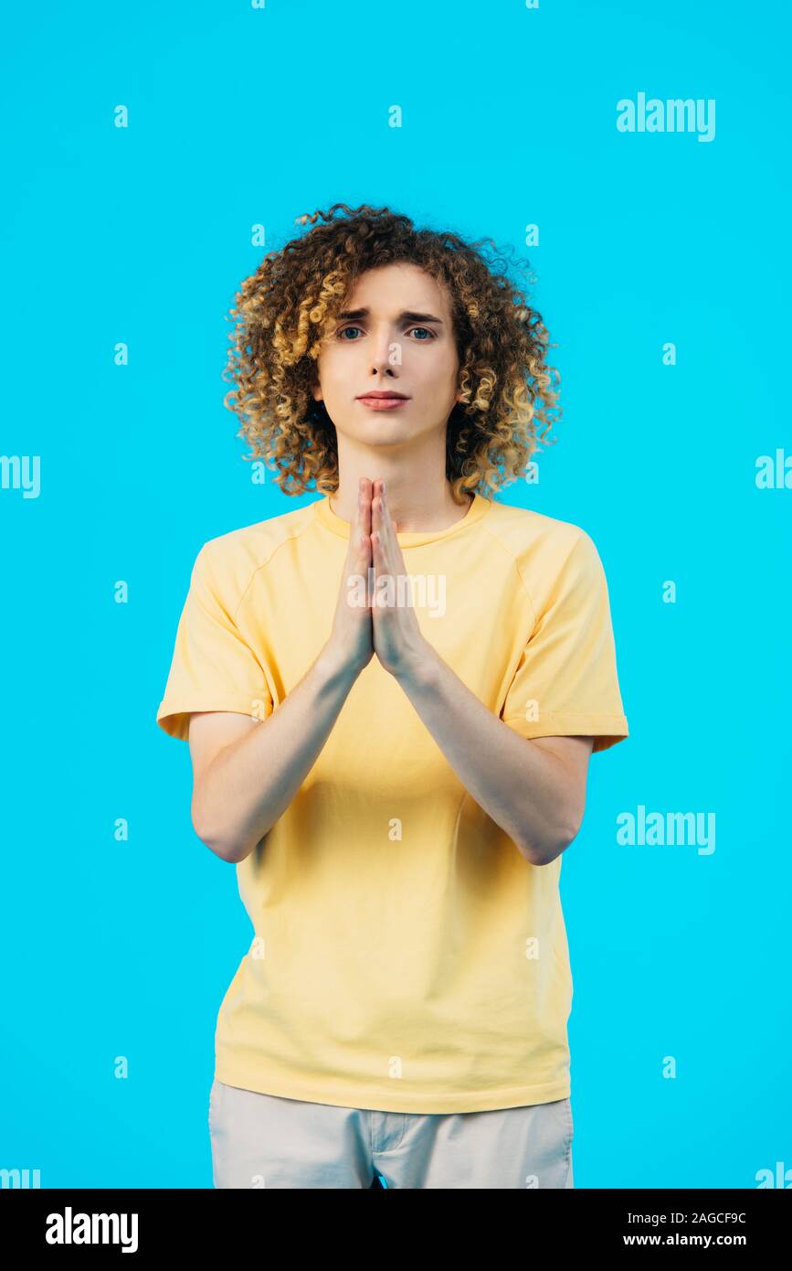 Curly teenager praying hands hi-res stock photography and images - Alamy