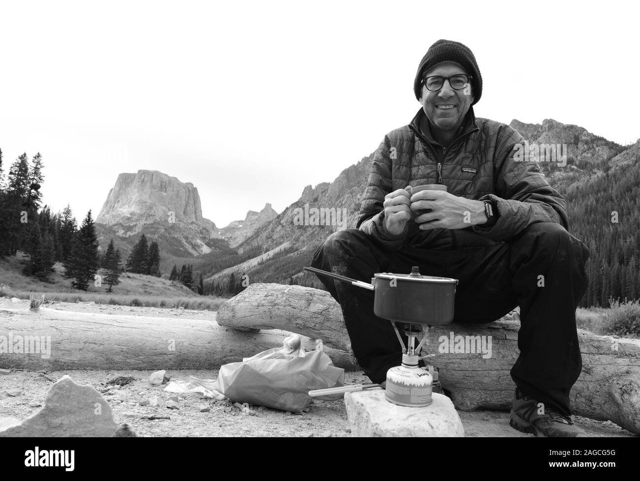 Selfie enjoying coffee with backpacking stove in the Wind Rivers and Squaretop Mountain, Wyoming. Stock Photo