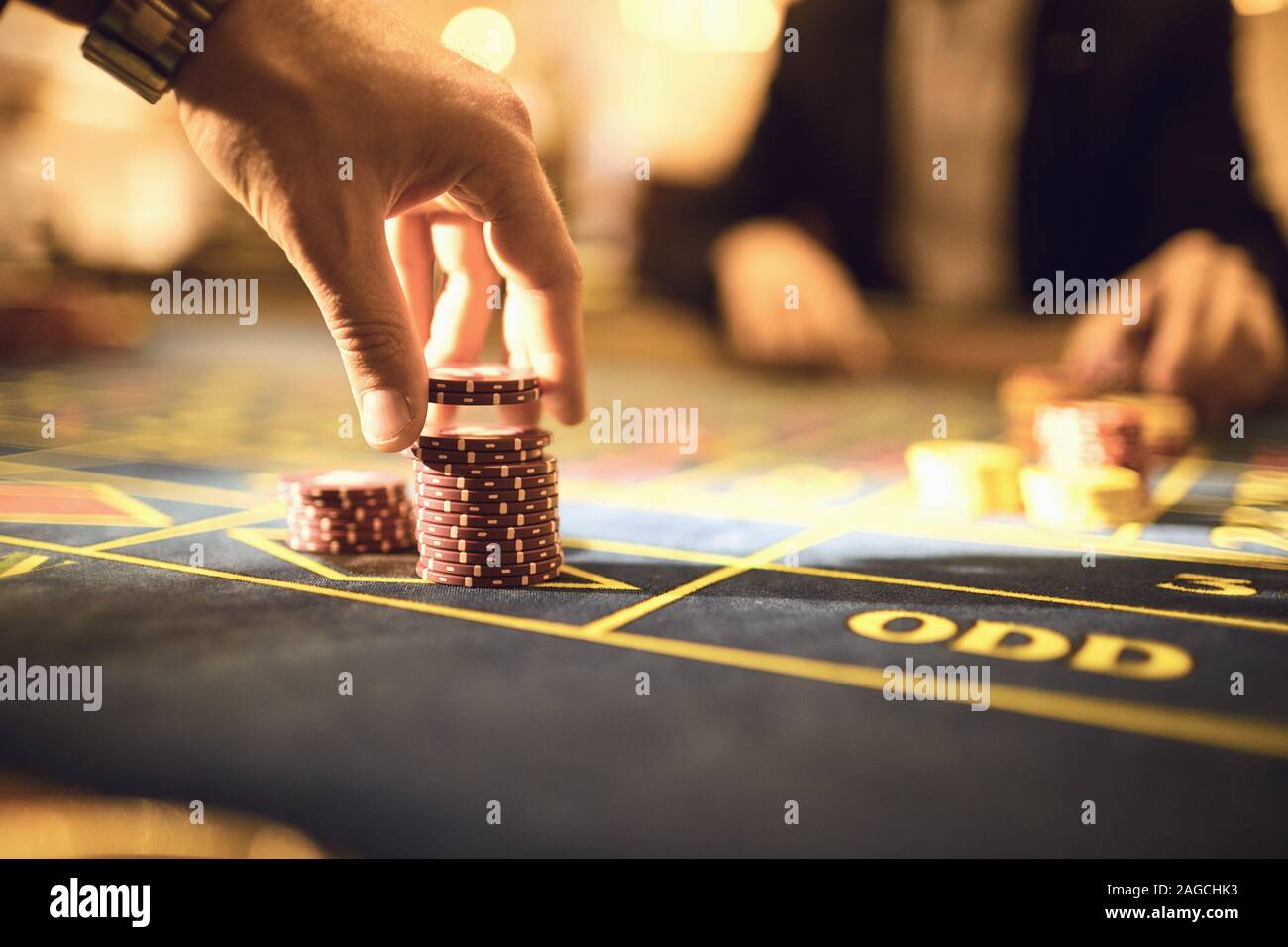 Hand players make bets chips to play roulette in a casino Stock Photo