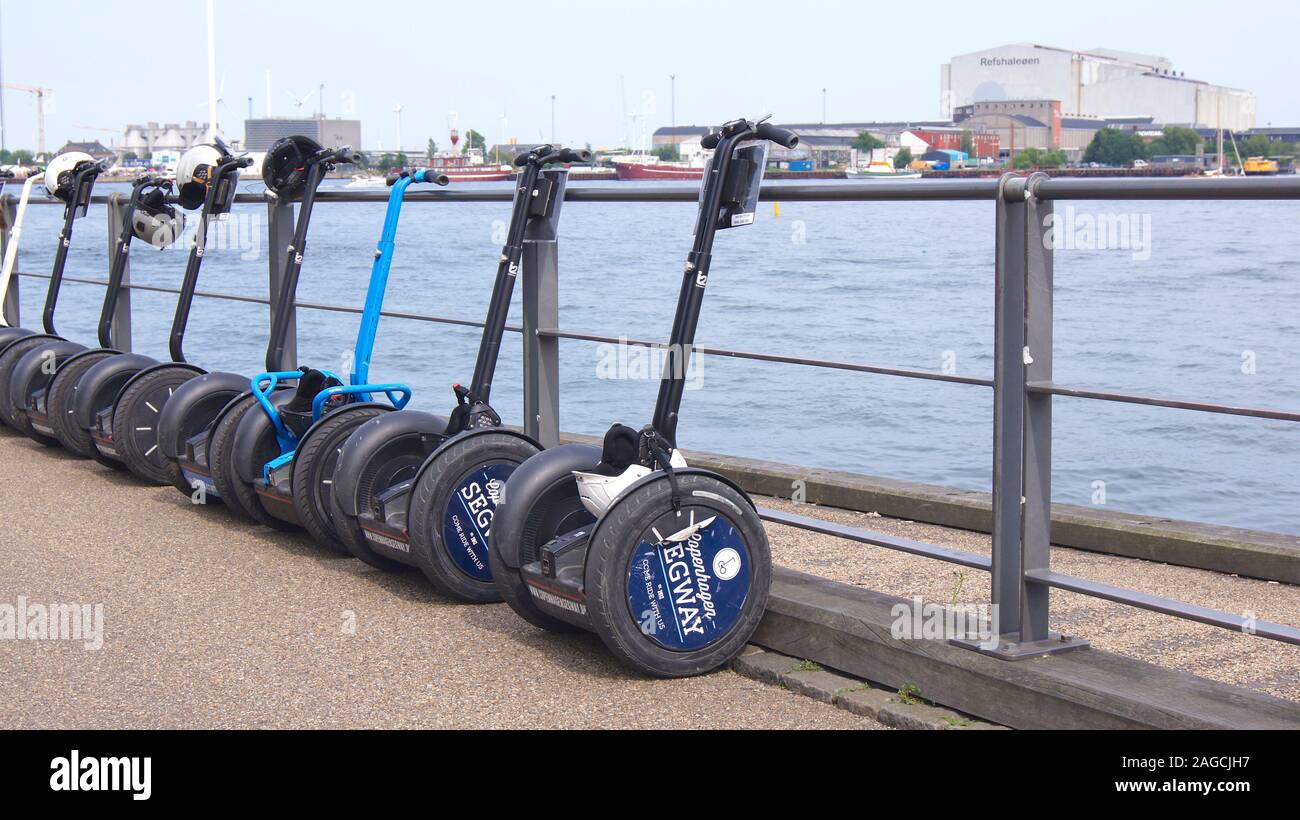 COPENHAGEN, DENMARK - JUL 04th, 2015: Modern electric segway for sightseeing tour parked next to river, ride on electric self-balancing board in Stock Photo