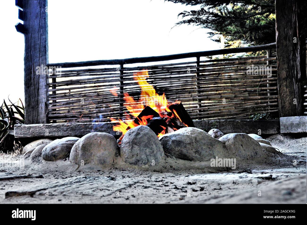 Beautiful low angle shot of a burning bonfire at the beach Stock Photo