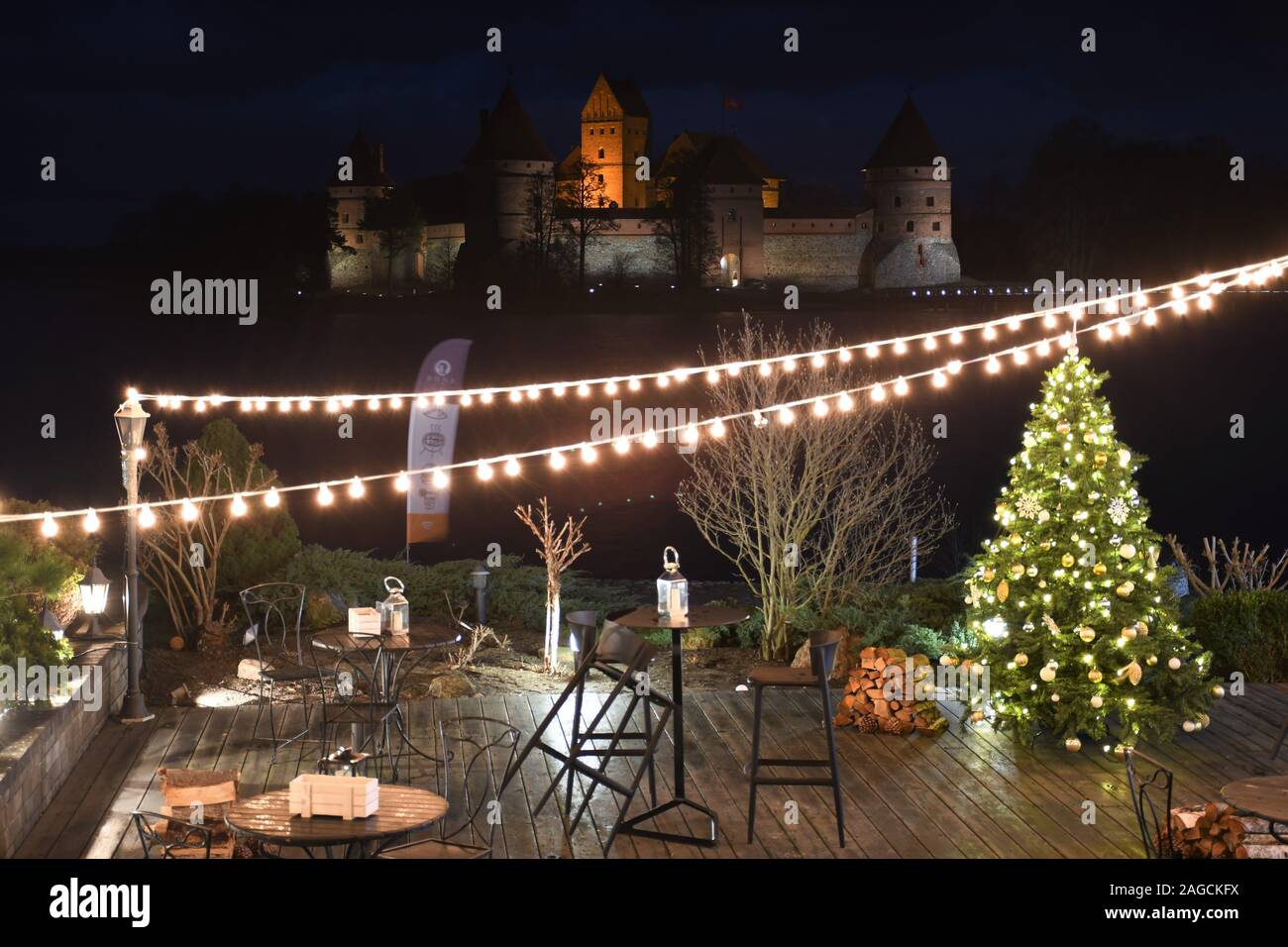 Medieval castle of Trakai, Vilnius, Lithuania, located between beautiful lakes and nature, view from a restaurant with Christmas tree and decorations Stock Photo