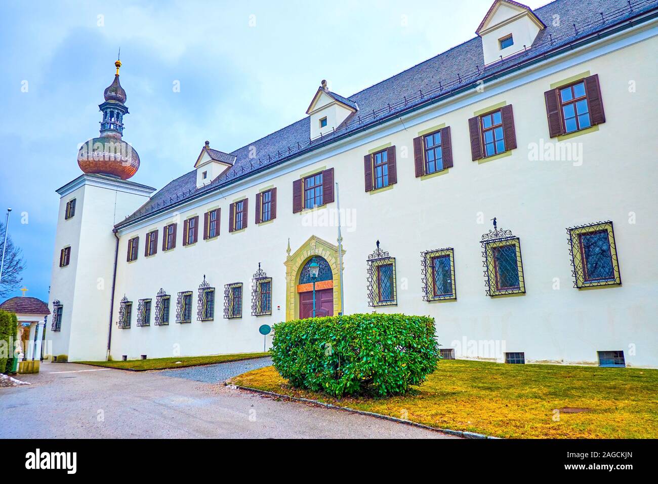 The scenic facade of the Orth Landschloss castle with main entrance gates and the side tower, Gmunden, Austria Stock Photo