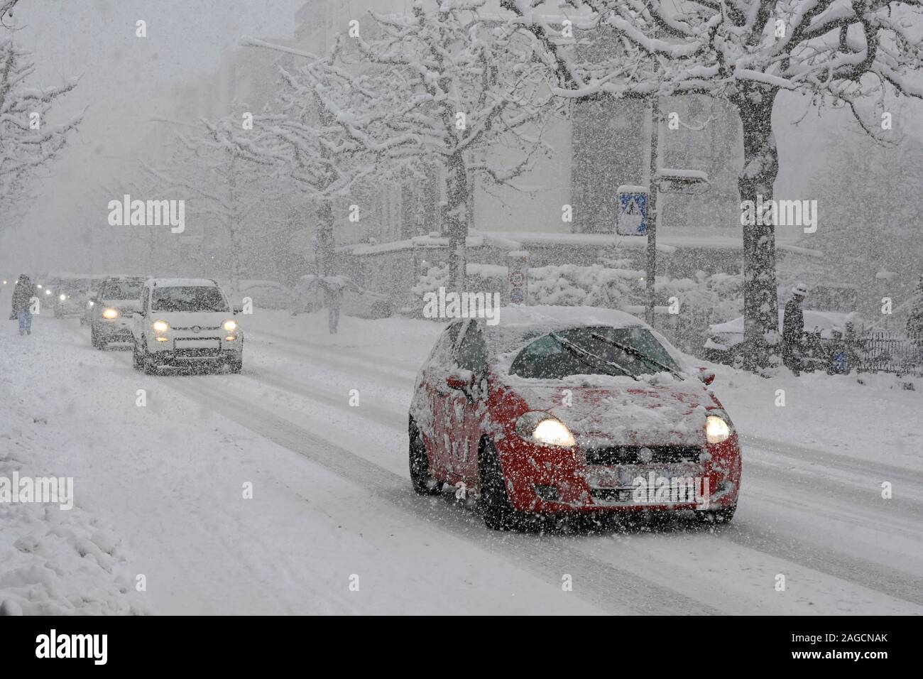 Cars during heavy snowfall on snowcovered road, Visp, Switzerland